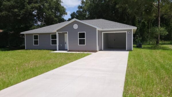 Front view of a custom built spec house in Silver Springs Shores, FL